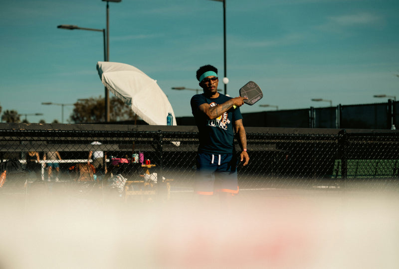 A Man is playing Pickleball in Malaysia - Arronax