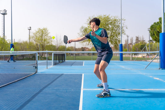 A Man is Playing Pickleball in Malaysia - Arronax