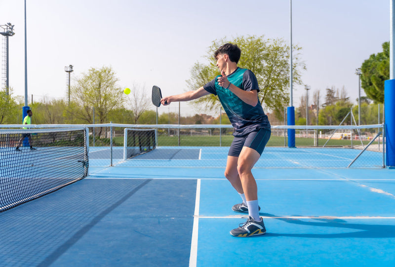A Man is Playing Pickleball in Malaysia - Arronax